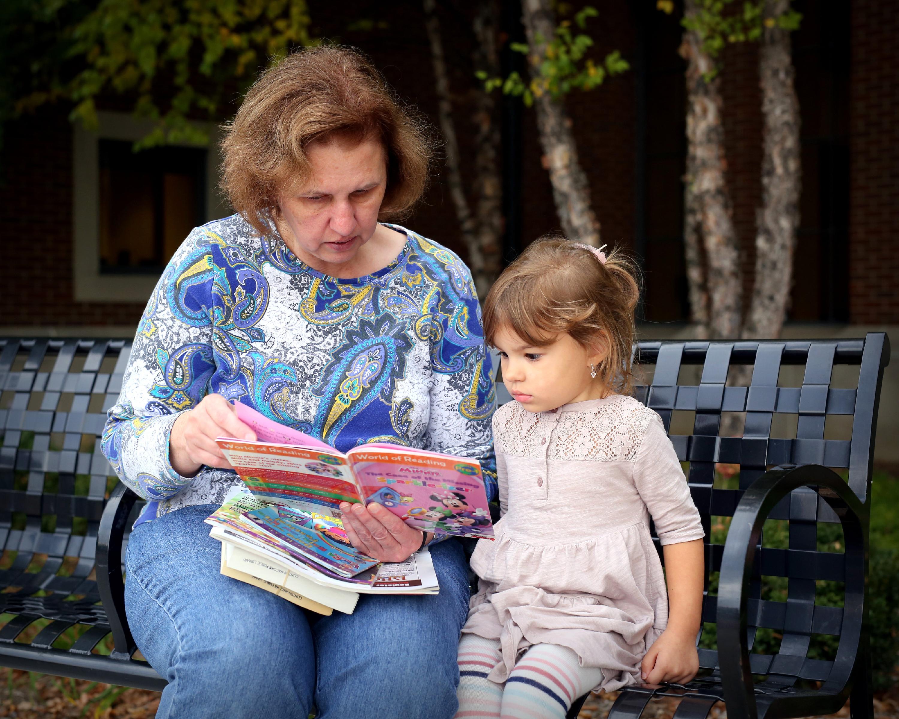 Image of grandma reading to child